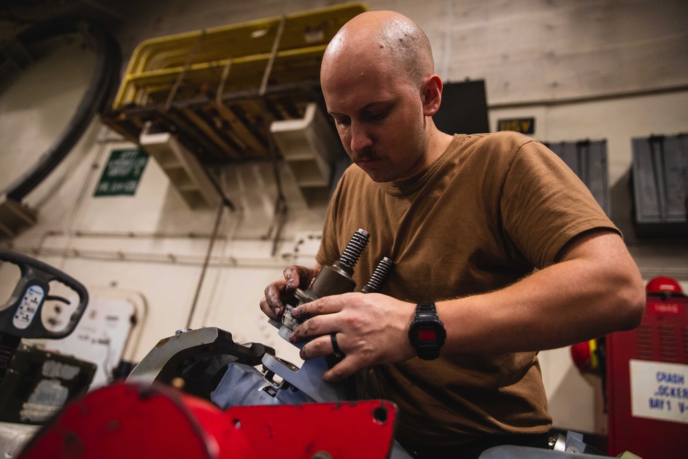 Sailor Performs Maintenance on Mh-60S Spindle