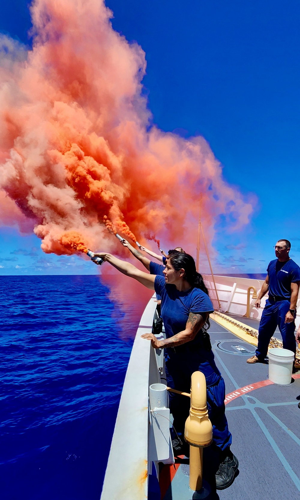 U.S. Coast Guard members conduct pyrotechnic training