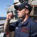 Sailor aboard USS Ramage (DDG 61) pipes while standing port lookout watch