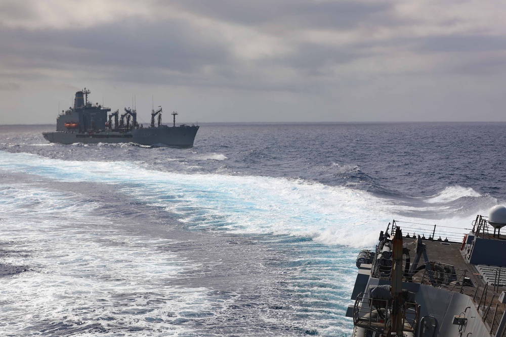 USS Thomas Hudner (DDG 116) breaks away from USNS Joshua Humphreys after a replenishment at sea