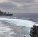 USS Thomas Hudner (DDG 116) breaks away from USNS Joshua Humphreys after a replenishment at sea