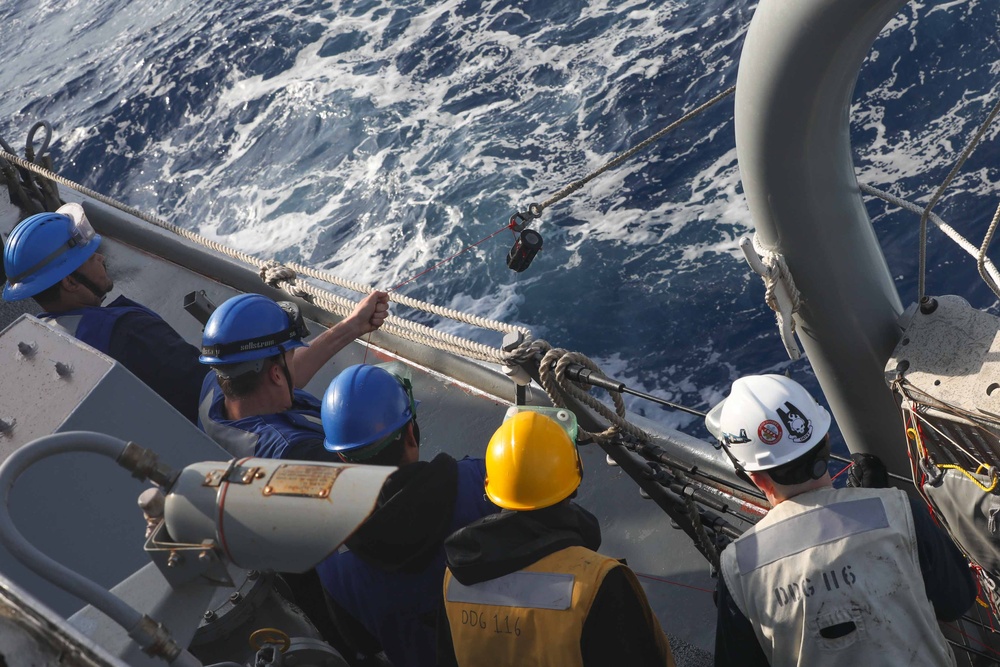 USS Thomas Hudner (DDG 116) conducts a replenishment at sea