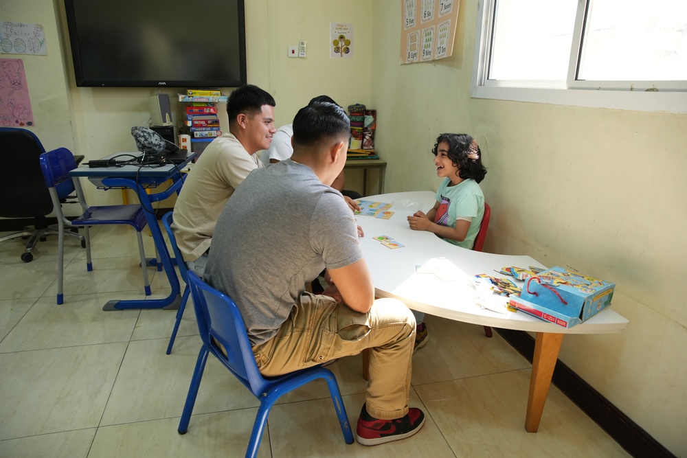 Marines with TF 51/5 volunteer at a local school in Bahrain
