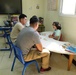 Marines with TF 51/5 volunteer at a local school in Bahrain