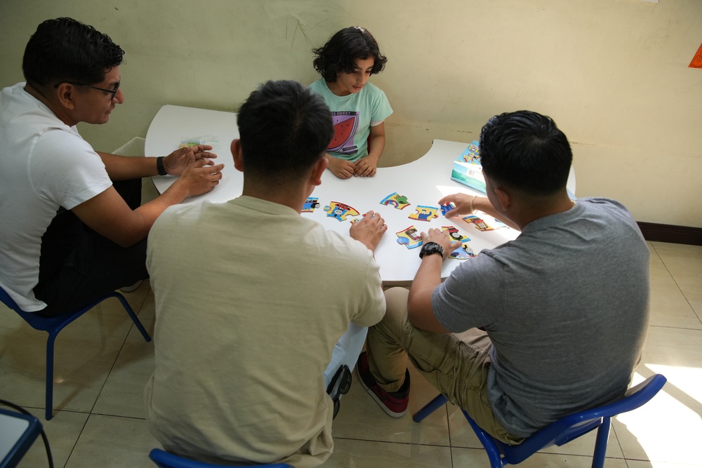 Marines with TF 51/5 volunteer at a local school in Bahrain