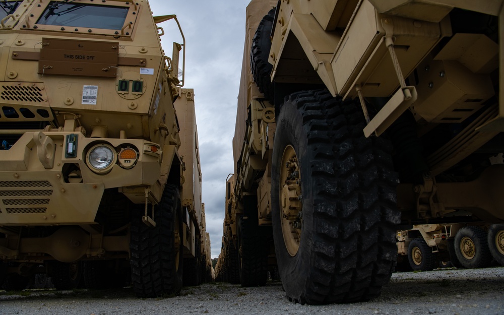 U.S. Army vehicles are loaded onto the USNS Pomeroy