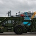 U.S. Army vehicles are loaded onto the USNS Pomeroy