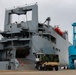 U.S. Army vehicles are loaded onto the USNS Pomeroy