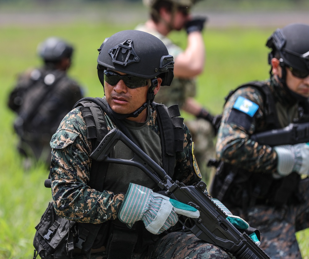 Navy SEALs conduct Fast Rope Insertion/Extraction System (FRIES) training with Guatemalan Naval Special Forces