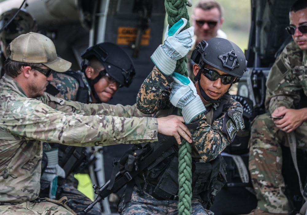 Navy SEALs conduct Fast Rope Insertion/Extraction System (FRIES) training with Guatemalan Naval Special Forces