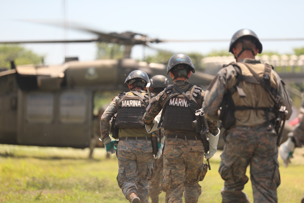 Navy SEALs conduct Fast Rope Insertion/Extraction System (FRIES) training with Guatemalan Naval Special Forces