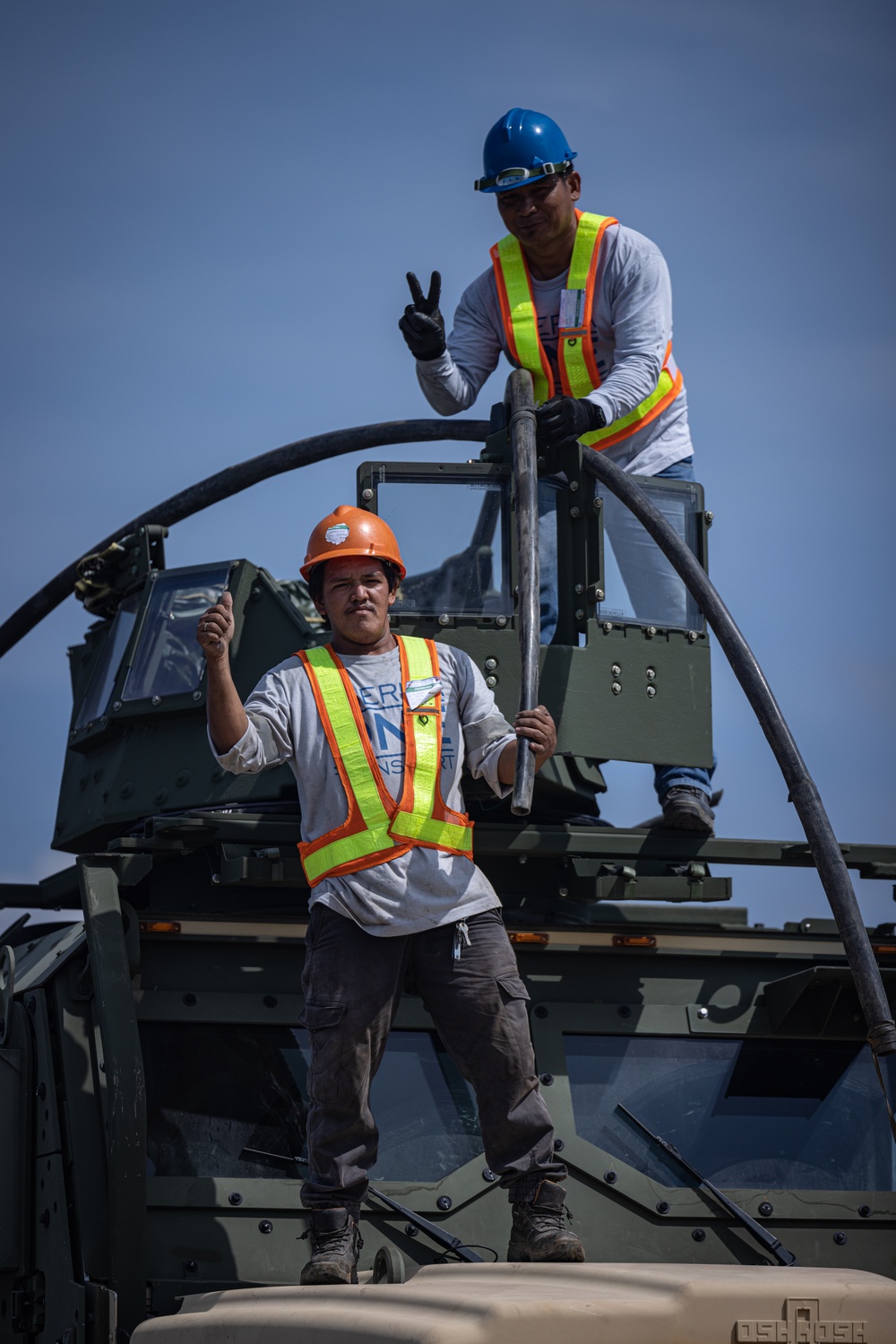 Marines, Soldiers, Airmen, and Filipino Civilians work together to send out equipment in preparation for Balikatan 23