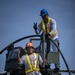 Marines, Soldiers, Airmen, and Filipino Civilians work together to send out equipment in preparation for Balikatan 23