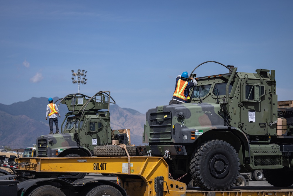 Marines, Soldiers, Airmen, and Filipino Civilians work together to send out equipment in preparation for Balikatan 23