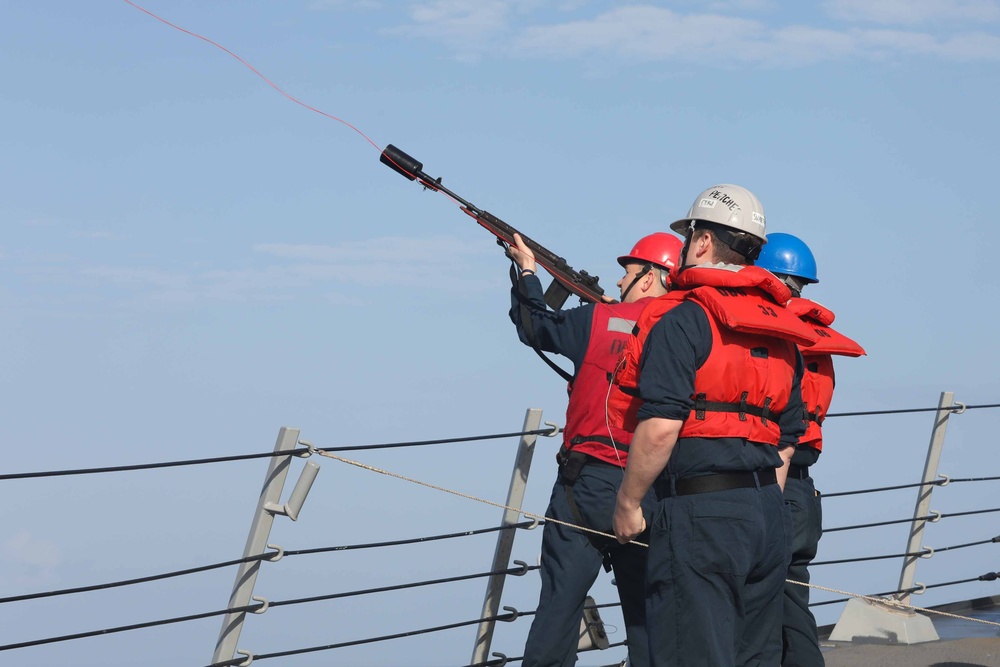 USS Thomas Hudner (DDG 116) conducts a replenishment at sea