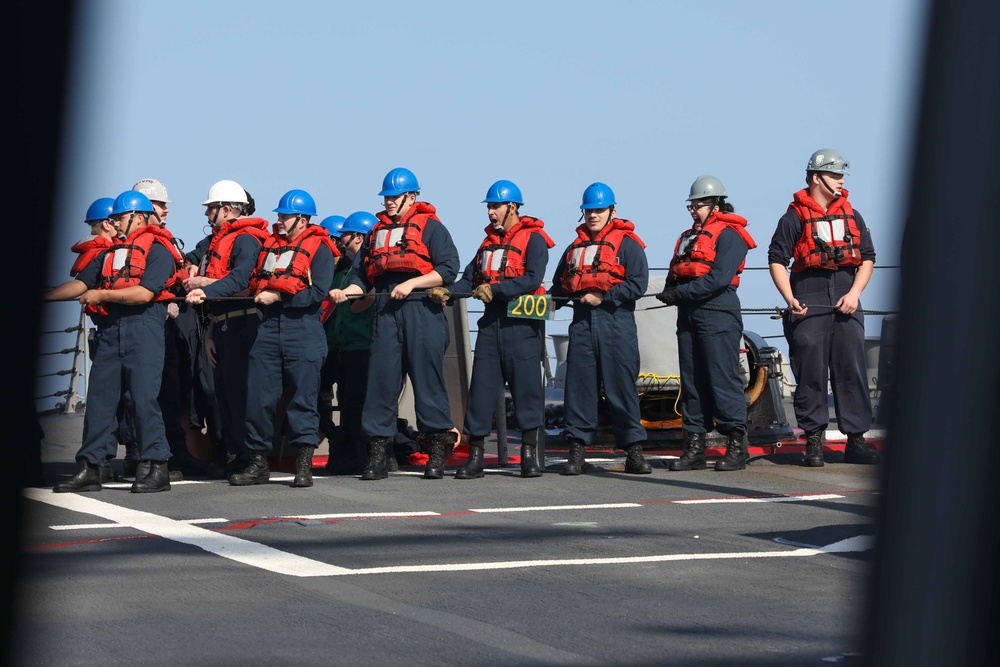 USS Thomas Hudner (DDG 116) conducts a replenishment at sea