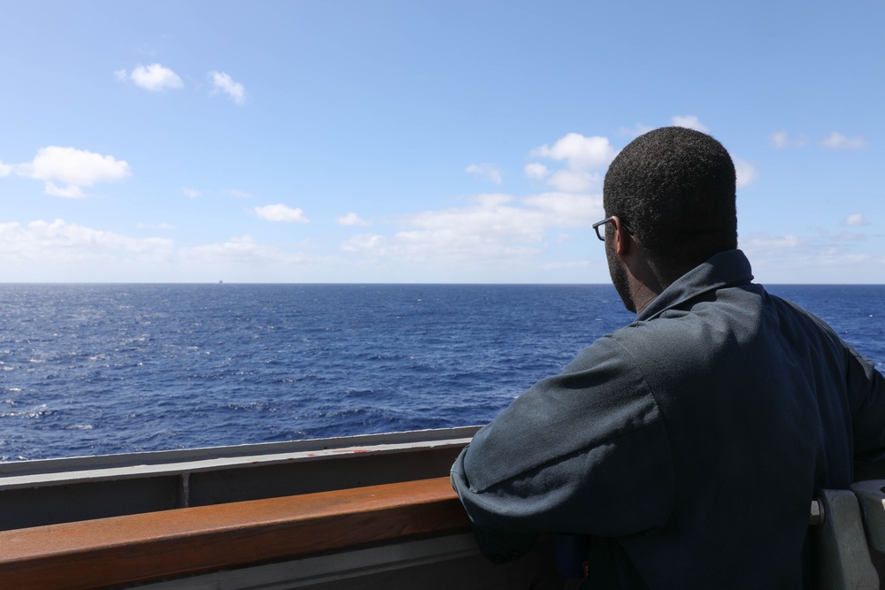 A sailor aboard USS Ramage on watch