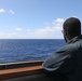 A sailor aboard USS Ramage on watch