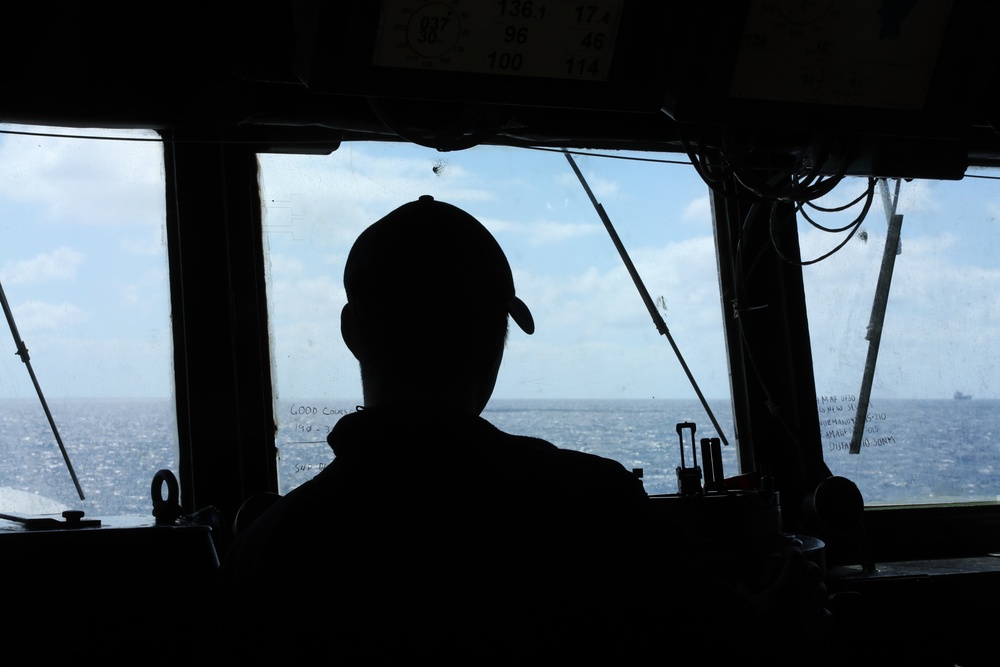 A Sailor aboard USS Ramage stands watch