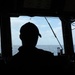 A Sailor aboard USS Ramage stands watch