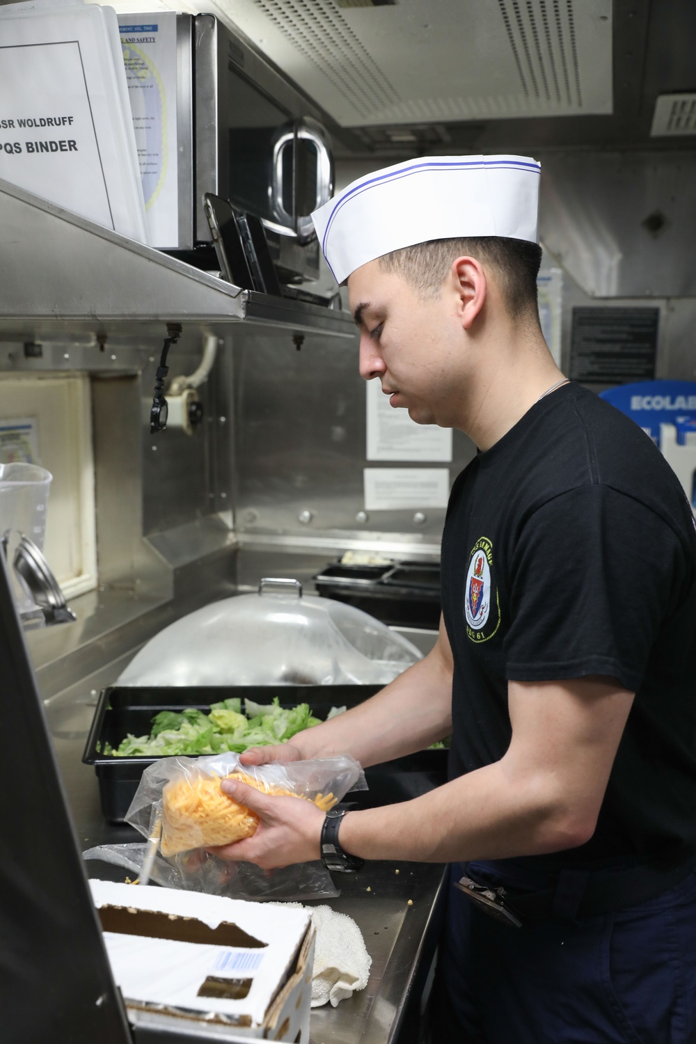 A Sailor aboard USS Ramage prepares lunch for the Wardroom