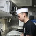 A Sailor aboard USS Ramage prepares lunch for the Wardroom