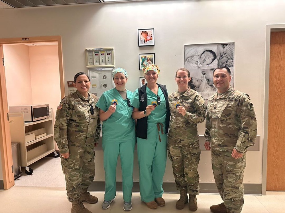 Tripler Army Medical Center Mother Baby Unit staff receive command coins