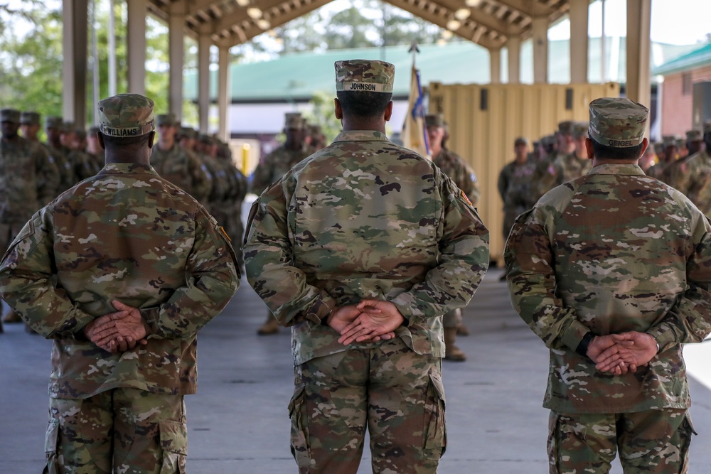 First Sergeants pass 135th Quartermaster Company guidon in ceremony