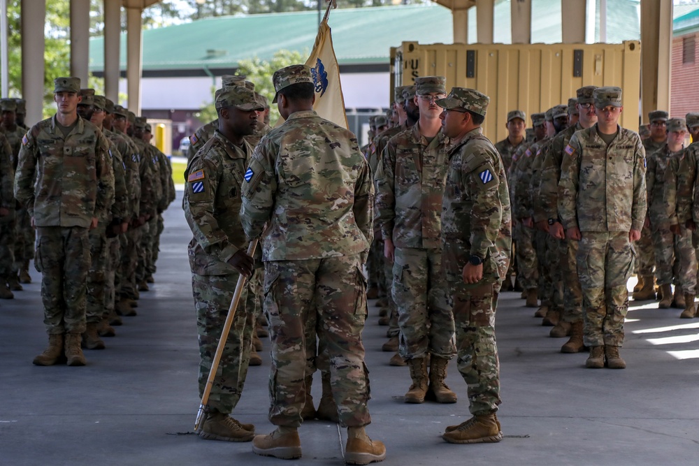 First Sergeants pass 135th Quartermaster Company guidon in ceremony