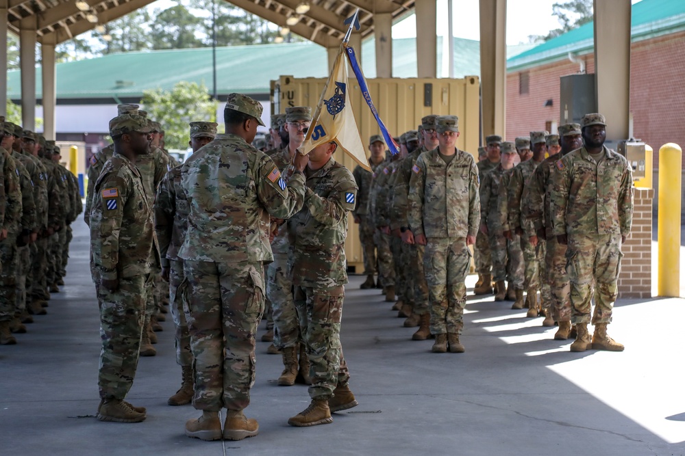 First Sergeants pass 135th Quartermaster Company guidon in ceremony