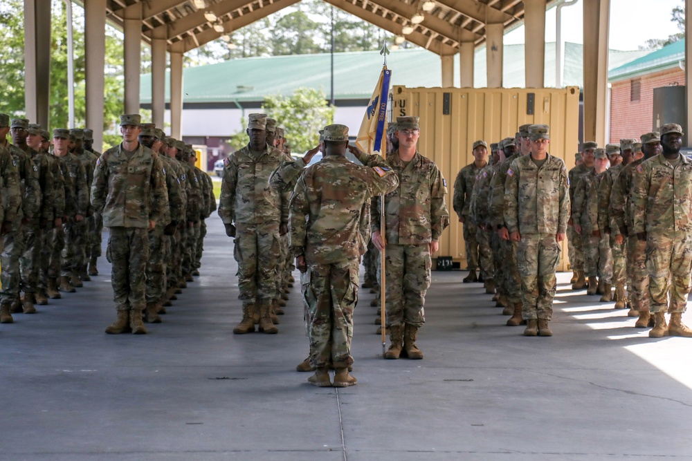 First Sergeants pass 135th Quartermaster Company guidon in ceremony