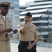 A touching moment during a re-enlistment ceremony aboard Battleship Wisconsin