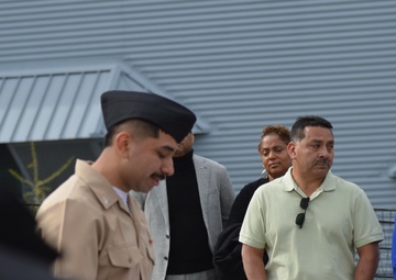 A touching moment during a re-enlistment ceremony aboard Battleship Wisconsin