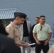 A touching moment during a re-enlistment ceremony aboard Battleship Wisconsin