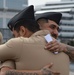 A touching moment during a re-enlistment ceremony aboard Battleship Wisconsin