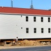 Contractors prepare second round of World War II-era barracks buildings to be moved at Fort McCoy