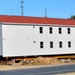 Contractors prepare second round of World War II-era barracks buildings to be moved at Fort McCoy