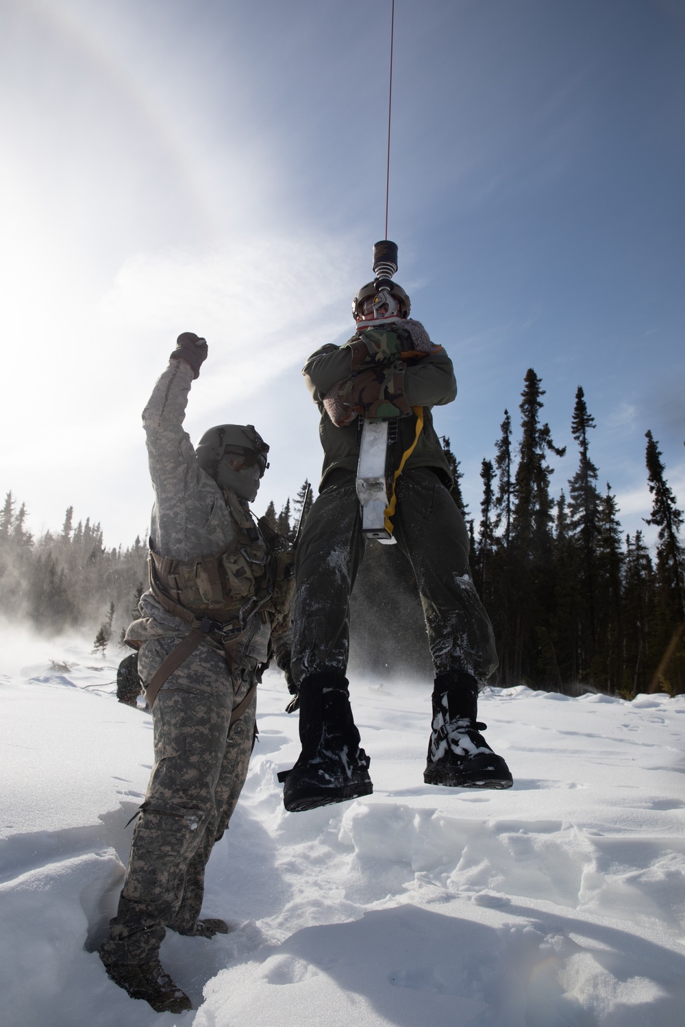 Simulated casualty hoisted to safety during JPMRC-AK 23-02