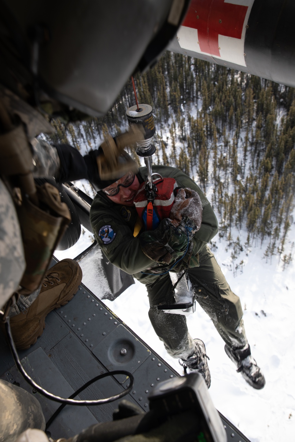 Simulated casualty hoisted to safety during JPMRC-AK 23-02