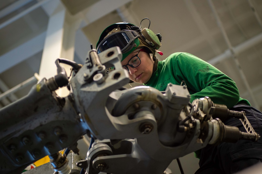 Helicopter Sea Combat Squadron (HSC) 4 Sailors Perform Maintenance Aboard USS Carl Vinson (CVN 70)