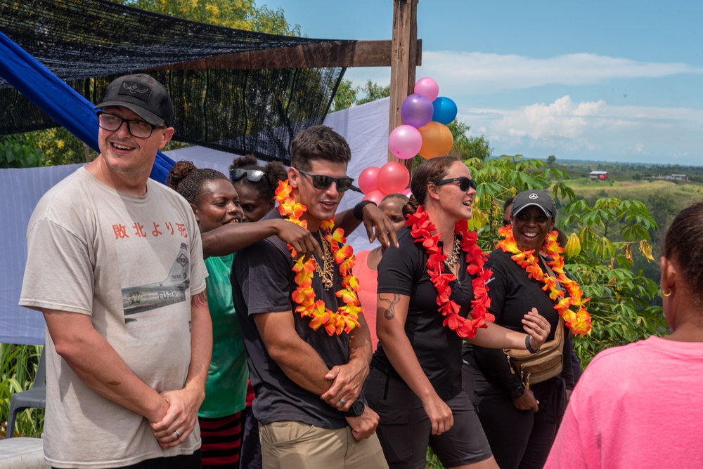 Solomon Islanders and DPAA Members celebrate the end of a Recovery Mission