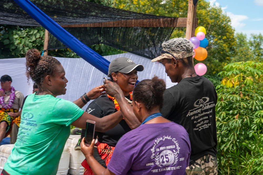 Solomon Islanders and DPAA Members celebrate the end of a Recovery Mission