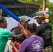 Solomon Islanders and DPAA Members celebrate the end of a Recovery Mission