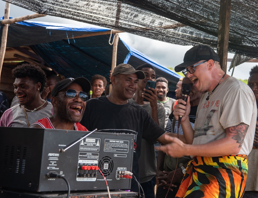 Solomon Islanders and DPAA Members celebrate the end of a Recovery Mission