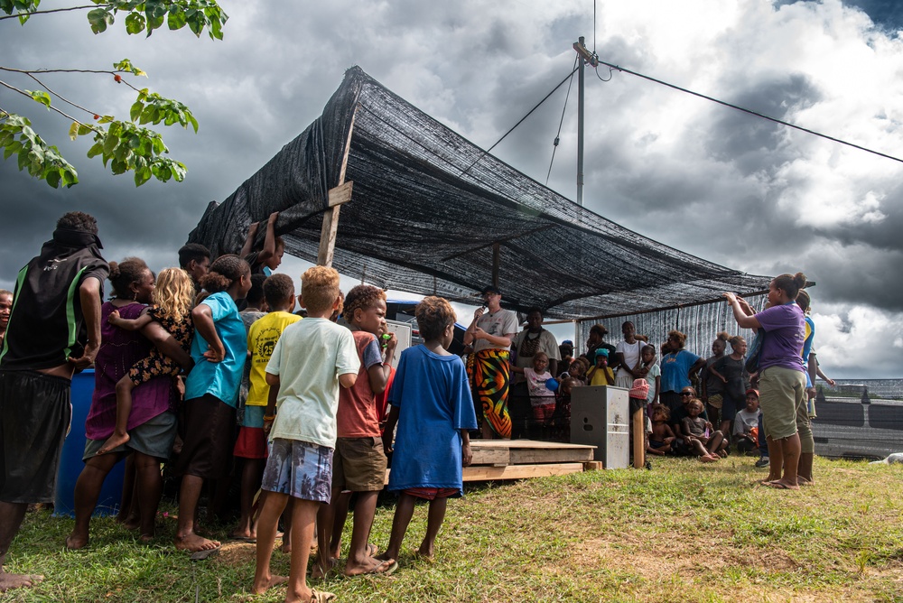 Solomon Islanders and DPAA Members celebrate the end of a Recovery Mission