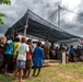 Solomon Islanders and DPAA Members celebrate the end of a Recovery Mission