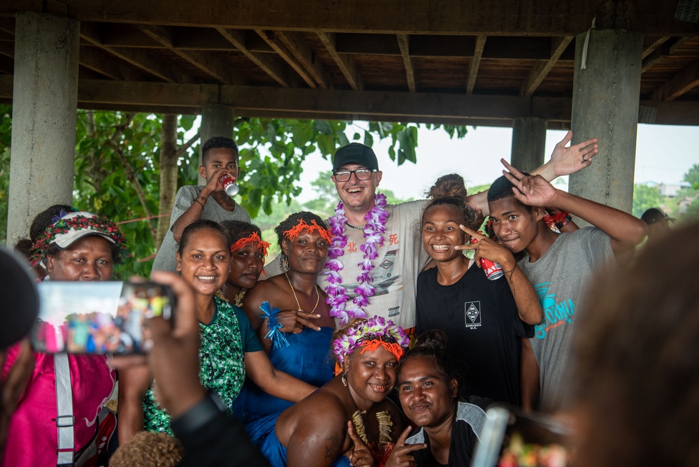 Solomon Islanders and DPAA Members celebrate the end of a Recovery Mission