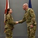 Command Chief coins Staff Sgt. Saquilan