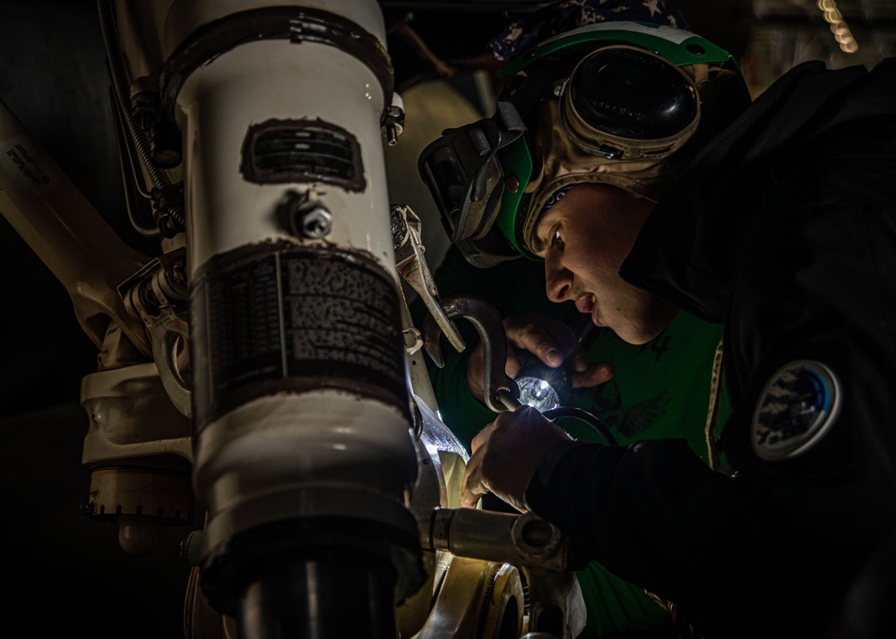 Sailors Perform Routine Maintenance On Aircraft