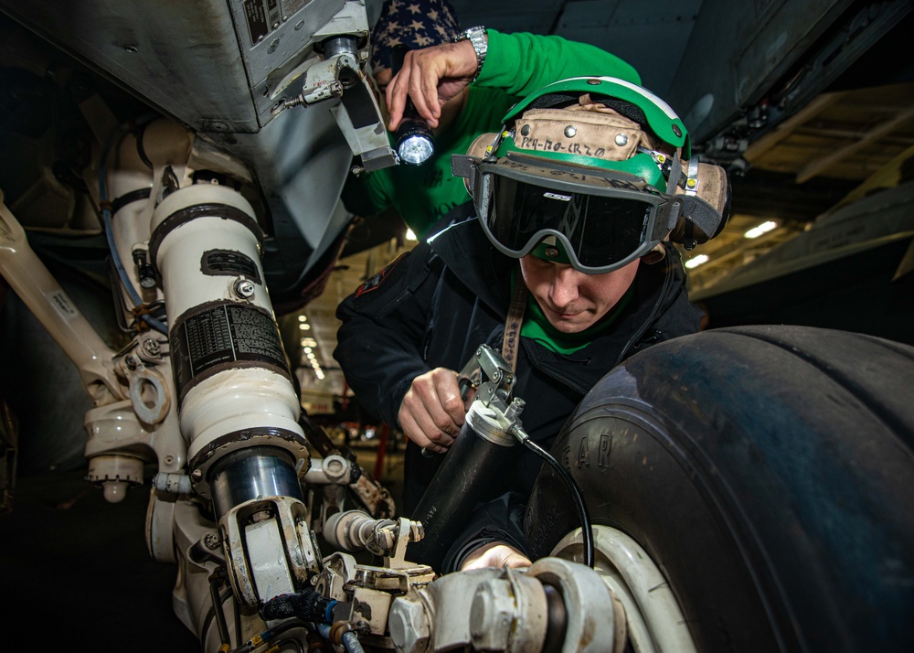 Sailors Perform Routine Maintenance On Aircraft
